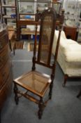 A set of six walnut high back dining chairs with cane work backs and seats.