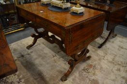 A very good Regency rosewood and brass inlaid sofa table.