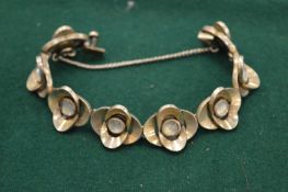 A silver and moon stone style bracelet.