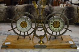 A late 19th century nautical themed presentation clock and barometer.