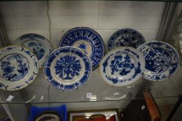A group of seven blue and white tin glazed plates.