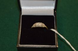 An 18ct gold, platinum and diamond ring.