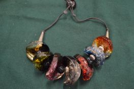 A chunky amber style necklace.