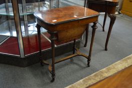 A good Victorian figured walnut and marquetry inlaid work table.