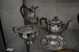 A silver twin handled pedestal bowl, a silver teapot, circular silver dish and a white metal