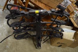 A tow bar mounted bike rack for four bikes.