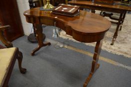 A good 19th century rosewood kidney shaped single drawer writing table.