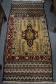 A Balouch rug, 163cm x 77cm.