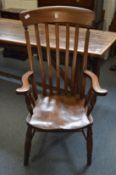 A Victorian beech and elm high back Windsor armchair.