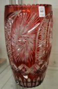 A large pair of Bohemian ruby tinted cut glass vases.