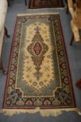 A machine made Persian style rug, 184cm x 91cm.