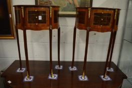 A pair of French style demi lune three drawer bedside tables.