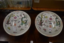 A pair of Chinese famille rose porcelain dishes and covers.