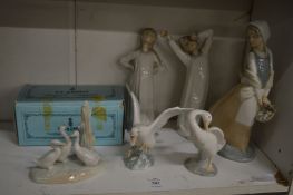 Lladro and Nao porcelain figures.