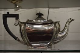 A silver teapot.