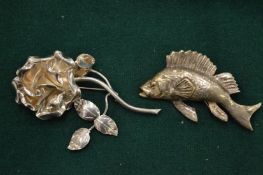 Two silver brooches.