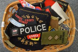 A collection of military and police woven badges.