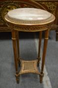 A giltwood and marble top circular occasional table or jardiniere stand.