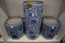A Chinese blue and white stick stand and pair of matching jardinieres (stick stand damaged).