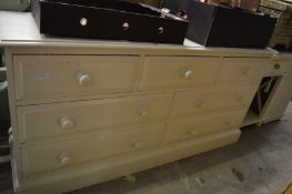 A large pine chest of drawers.