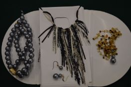 A decorative blue bead necklace etc.