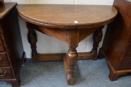 An 18th century oak credence table.