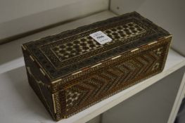 An Eastern decoratively inlaid sandalwood box.