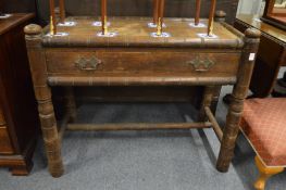 An unusual oak 'Turners' single drawer side table.