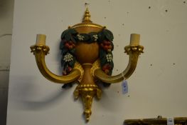 A good pair of carved and painted naturalistic form gilt wood two branch wall appliques.