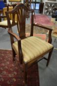 A set of nine Georgian style mahogany dining chairs, one with arms.