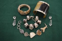 Three decorative silver bracelets, a horn and silver cuff bracelet and a pair of decorative