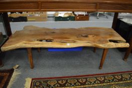 A yew wood rustic style plank top coffee table.