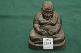 A cast bronze Buddha.