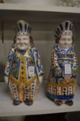 A pair of Faience decorated figural jugs.