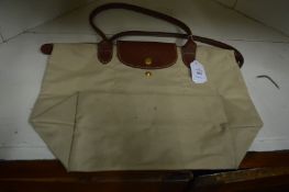 A Longchamp folding bag.