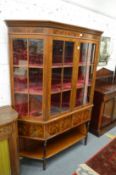 A good Sheraton style mahogany and satinwood banded display cabinet on stand.