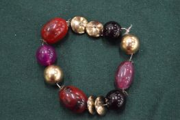 A heavy bead necklace.