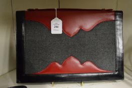 A Pellegrino clutch bag.