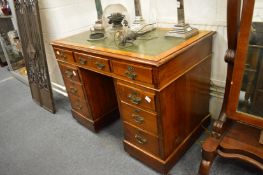 An oak twin pedestal desk.