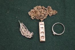 A small silver ingot pendant and chain and other items.
