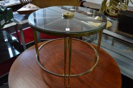 An unusual glass and brass coffee table, the top formed as a wheel.