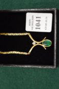 An 18ct yellow gold diamond and emerald pendant with 18ct yellow gold chain.