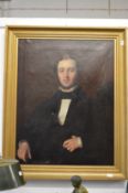 19th century English school, half length portrait of a seated gentleman wearing a black jacket,