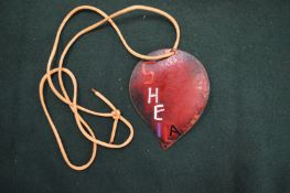An enamel decorated pendant.