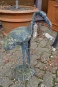 A lead garden ornament modelled as a bird.