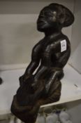 An African carved wood figure.