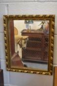 A small gilt wood mirror.