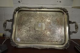 A large plated tray with engraved decoration.