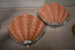 A pair of Art Deco pink glass and chrome shell shaped wall lights.