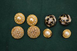 Four pairs of decorative ear clips.